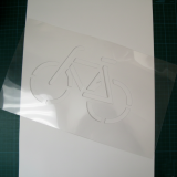 Clear PET-film reusable stencil with a bicycle icon cut in